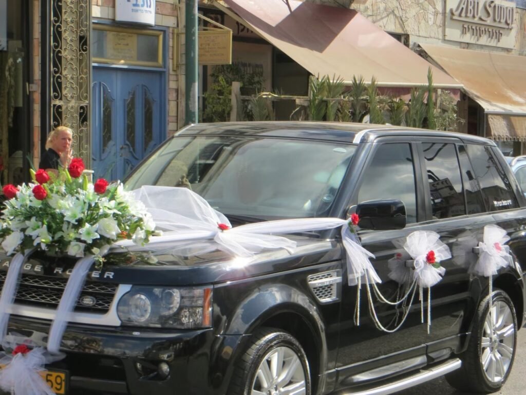 “Luxury BMW and Mercedes wedding cars decorated for marriage in Lucknow, showcasing easy online booking process with chauffeur service for weddings and VIP events.