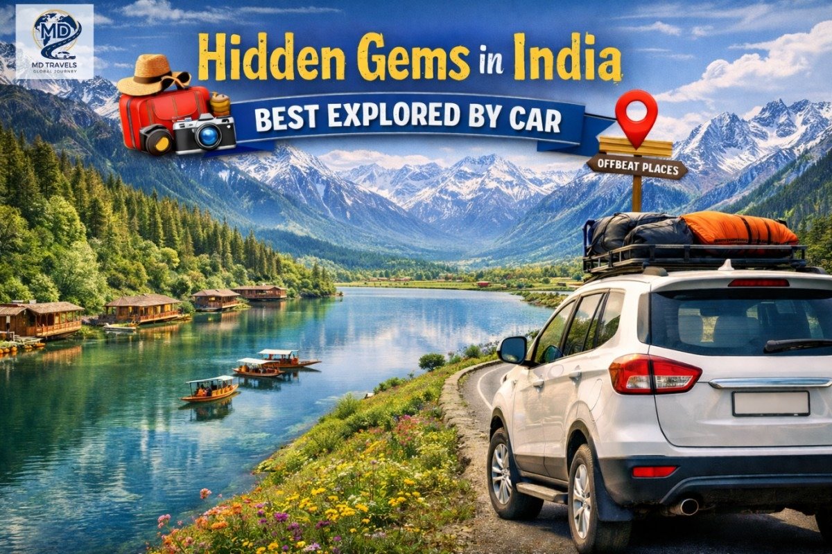 Promotional travel banner showing a white SUV parked on a scenic lakeside mountain road in India, with snow-capped peaks, pine forests, houseboats on a clear blue lake, and colorful wildflowers in the foreground. Text reads “Hidden Gems in India – Best Explored by Car” with travel-themed graphics like a suitcase, camera, and location pin labelled “Offbeat Places.”